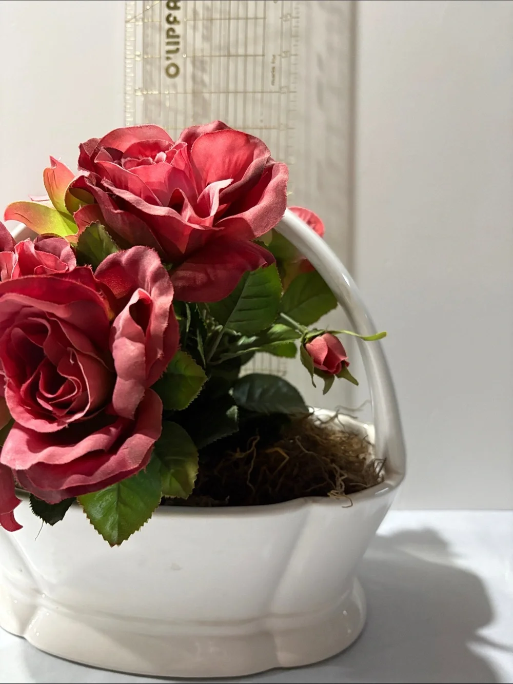 Rose Artificial Arrangement in White Ceramic Basket half moon bay California